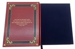 The bible opened to show the leather doublure with a gilt inscription and a navy silk flyleaf